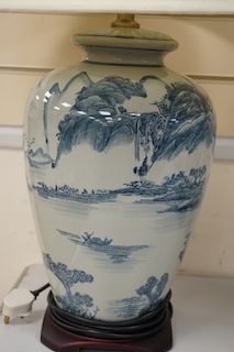 A pair of Japanese blue and white ceramic table lamps and shades, 71cm high overall. Condition - good, untested